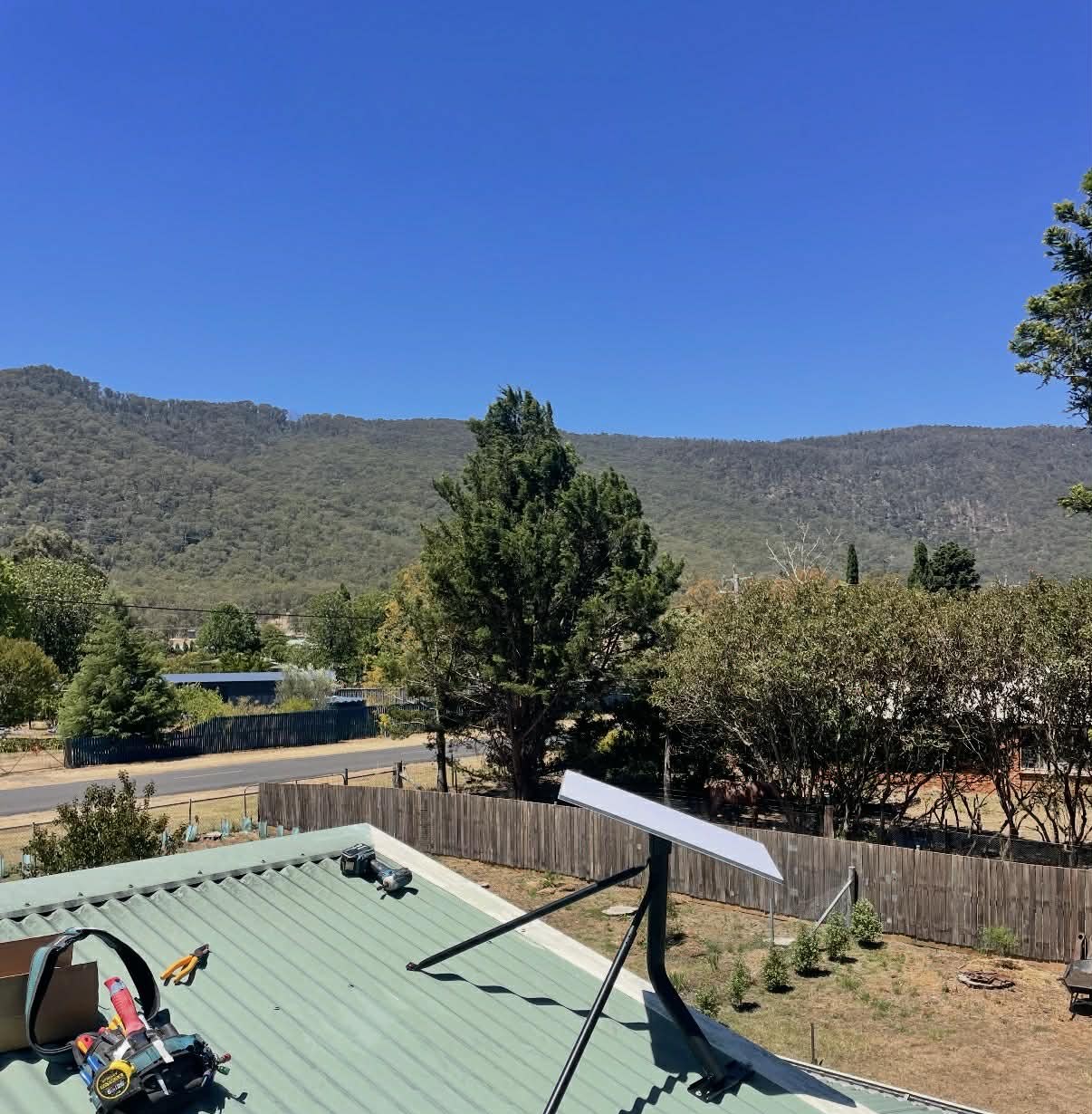 Satellite dish mounted on a metal roof